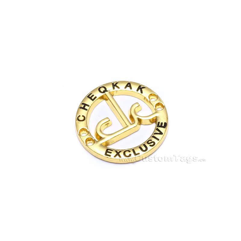 Custom hollow-out metal clothing label with precise laser-cut details