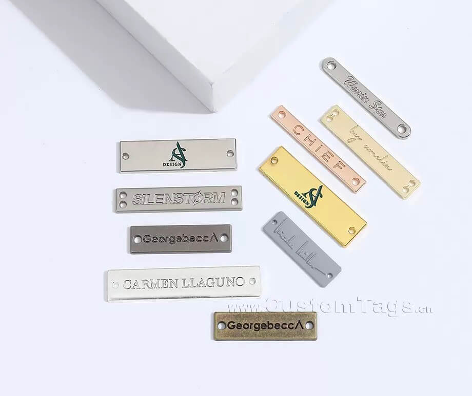Customized rectangular silver metal labels with sewing holes for denim and leather jackets