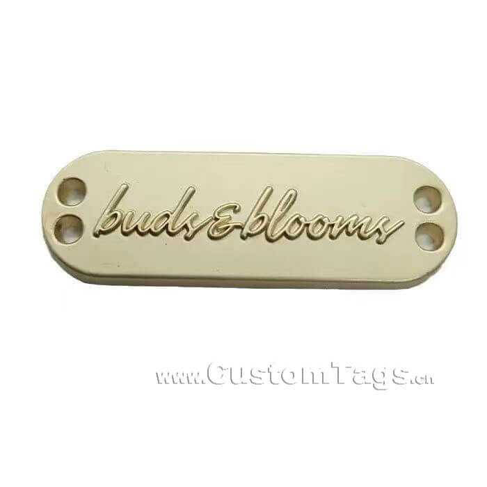 custom embossed metal labels and tags for clothing with logo